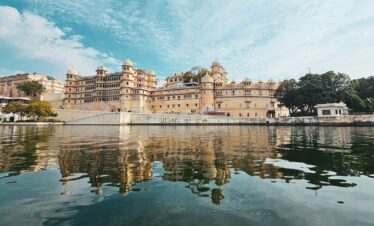 a large building sitting on top of a lake