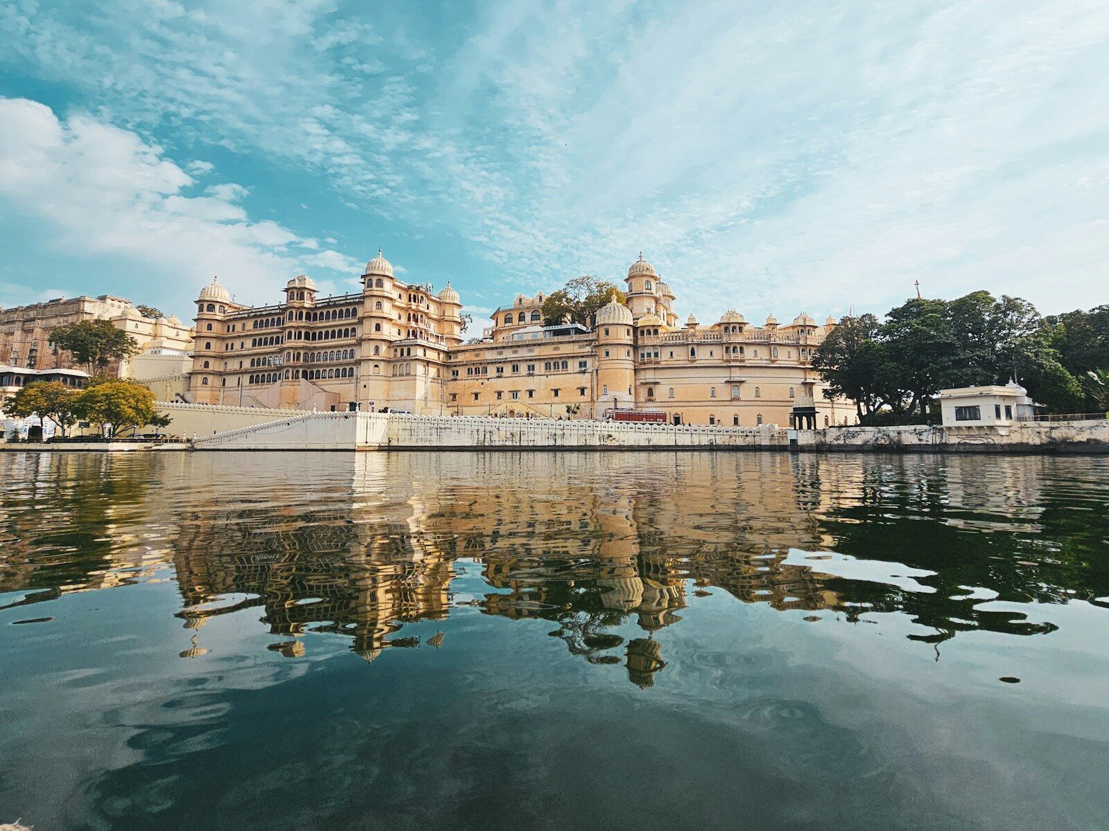 a large building sitting on top of a lake