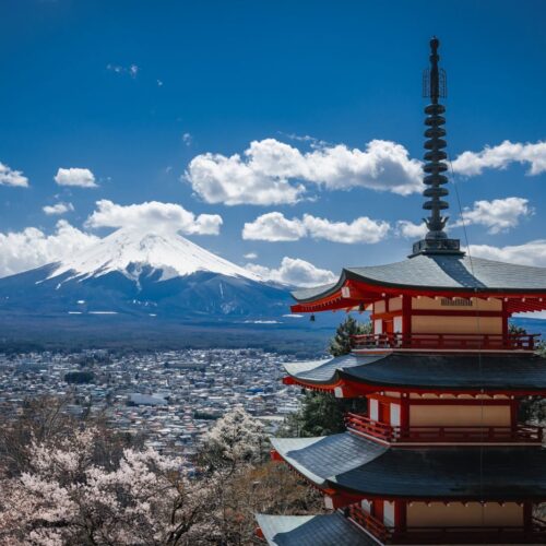 Stunning view of Chureito Pagoda and Mount Fuji with cherry blossoms in spring, Japan.