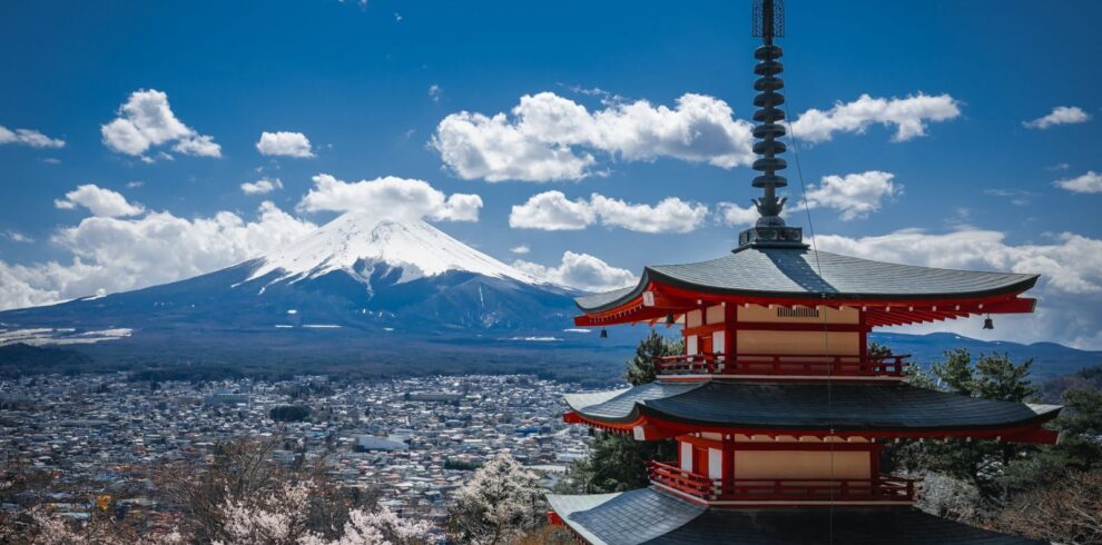 Stunning view of Chureito Pagoda and Mount Fuji with cherry blossoms in spring, Japan.