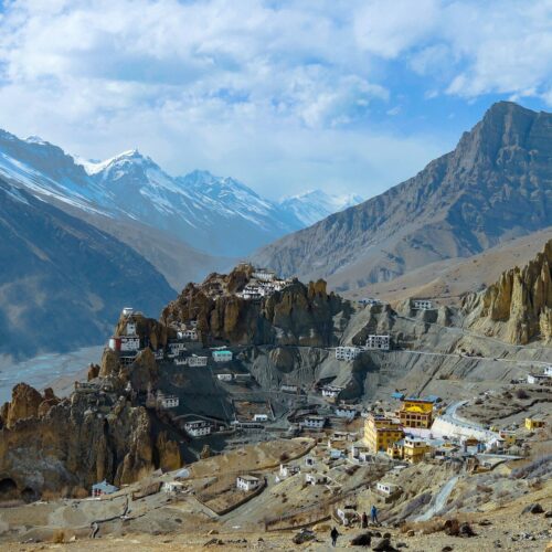 white and brown houses on mountain under blue sky during daytime