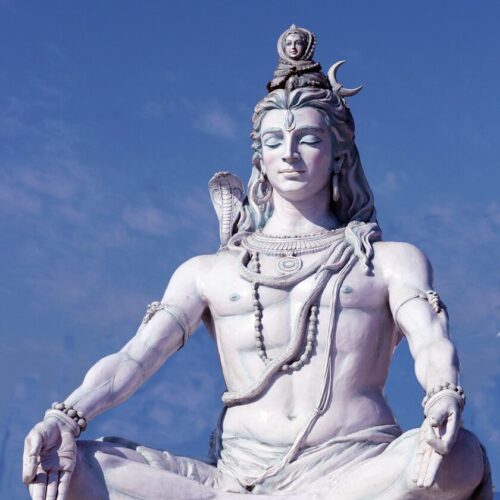 a statue of a person sitting in a lotus position